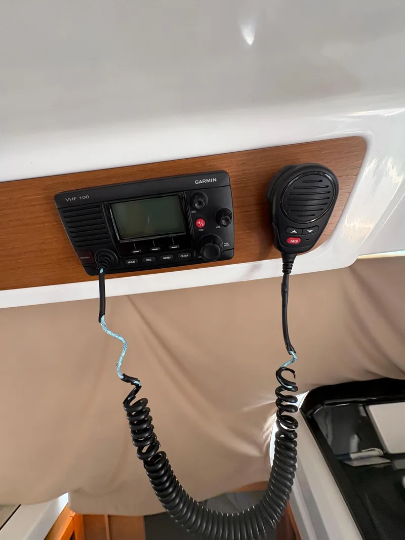 Slide: The Image of VHF radio and microphone on 2018 Jeanneau Merry Fisher 855 boat. - 23