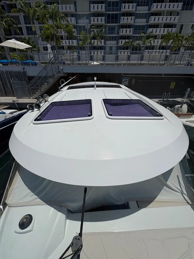 Slide: The Image of 2018 Jeanneau Merry Fisher 855 boat docked near modern building. - 25