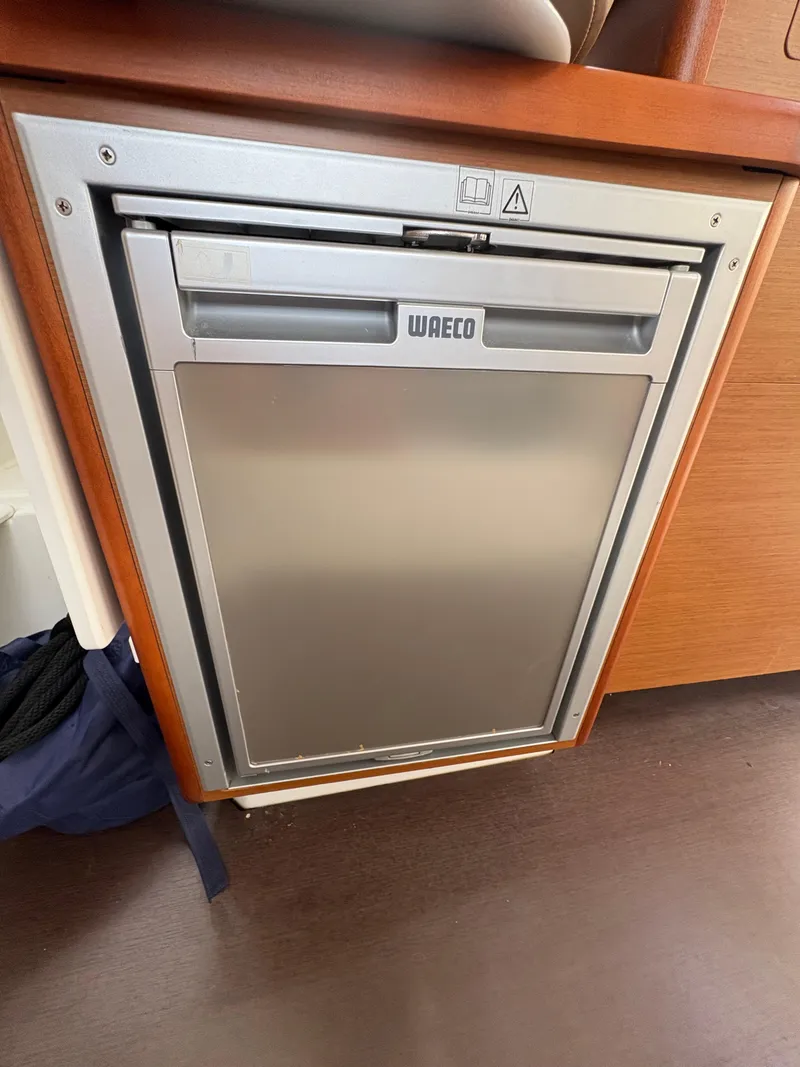 Slide: The Image of Compact Waeco fridge inside 2018 Jeanneau Merry Fisher 855 boat cabin. - 32