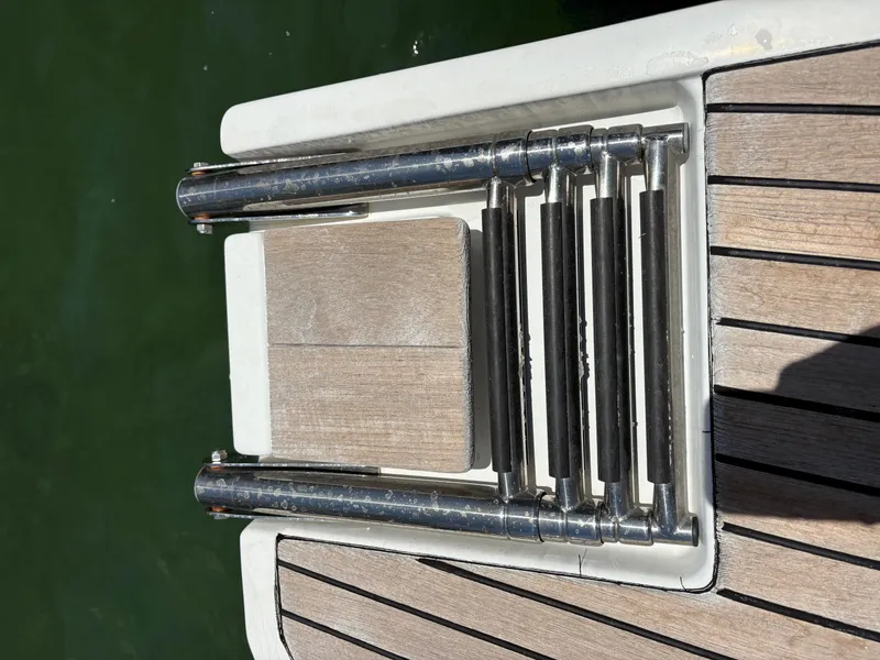 Slide: The Image of Boarding ladder on Jeanneau Merry Fisher 855, 2018 model, with teak decking. - 6