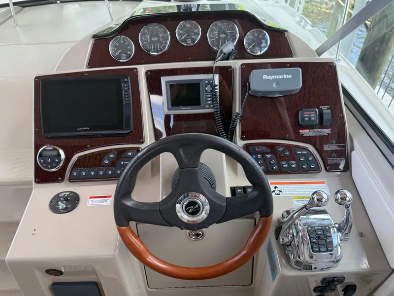 Slide: The Image of Helm of 2008 Sea Ray 330 Sundancer with advanced navigation and control systems. - 15