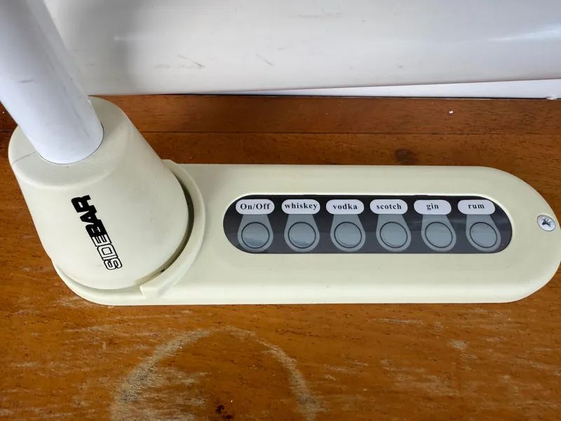 Slide: The Image of Control panel on a Sea Ray 330 Sundancer, featuring drink selection buttons. - 25