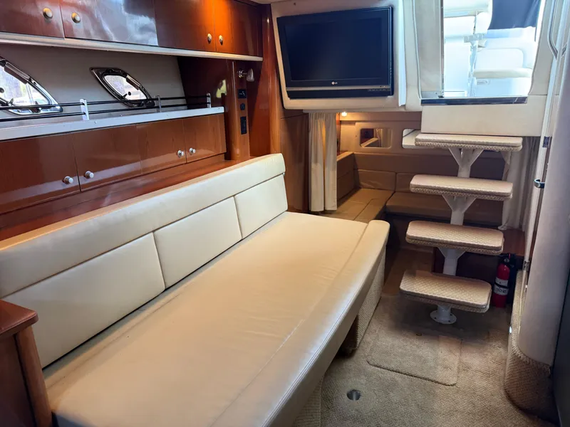 Slide: The Image of Interior of 2008 Sea Ray 330 Sundancer with sofa, TV, and stairs. - 29