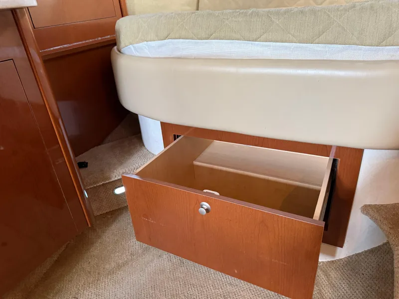 Slide: The Image of Open storage drawer under bed in 2008 Sea Ray 330 Sundancer cabin. - 31