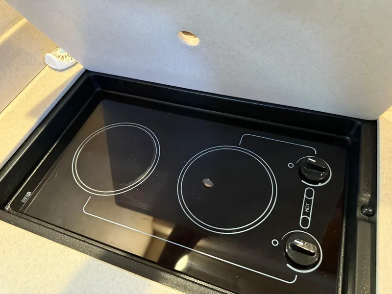 Slide: The Image of Stovetop in 2008 Sea Ray 330 Sundancer yacht kitchen area. - 37