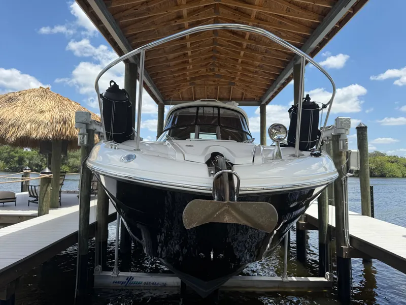 Slide: The Image of 2008 Sea Ray 330 Sundancer docked under a wooden canopy on a sunny day. - 4