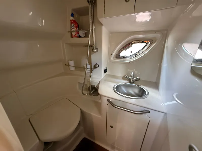 Slide: The Image of 2008 Sea Ray 330 Sundancer bathroom with sink, toilet, and showerhead. - 43