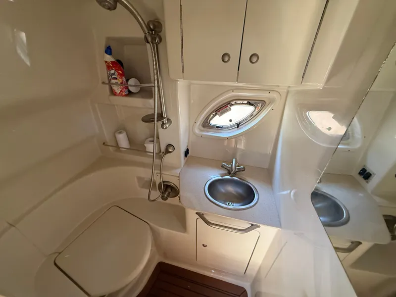 Slide: The Image of 2008 Sea Ray 330 Sundancer bathroom with sink, shower, and storage cabinets. - 44