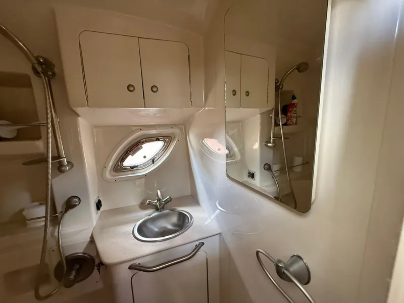 Slide: The Image of 2008 Sea Ray 330 Sundancer bathroom with sink, mirror, and showerhead. - 45