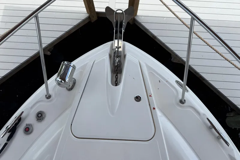 Slide: The Image of Bow of 2008 Sea Ray 330 Sundancer yacht at dock, featuring anchor and deck fittings. - 48