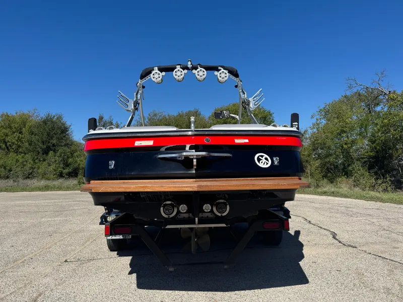 Slide: The Image of 2008 MasterCraft X45 boat rear view on a sunny day. - 11