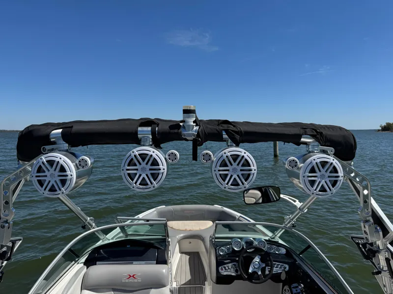 Slide: The Image of 2008 MasterCraft X45 boat with speakers on a sunny lake. - 25