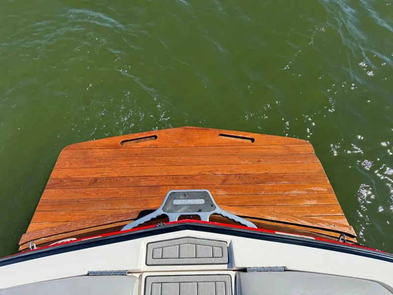 Slide: The Image of Rear view of 2008 MasterCraft X45 boat with wooden swim platform on water. - 29