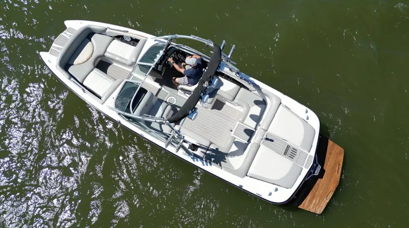 Slide: The Image of Aerial view of 2008 MasterCraft X45 boat on green water. - 6