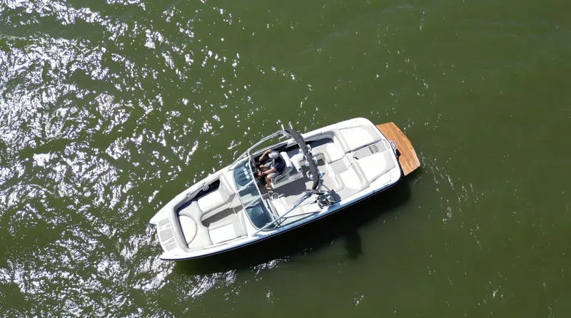 Slide: The Image of Aerial view of 2008 MasterCraft X45 boat on green water. - 7