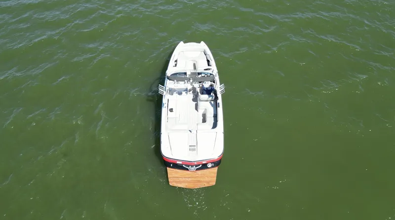 Slide: The Image of 2008 MasterCraft X45 boat on green water, aerial view. - 8