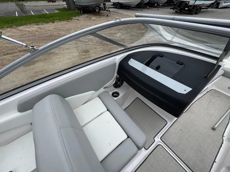 Slide: The Image of Interior of a 2021 Regal 1900 ES boat with seating and dashboard. - 7
