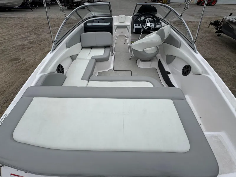 Slide: The Image of 2021 Regal 1900 ES boat interior with seating and steering wheel. - 9