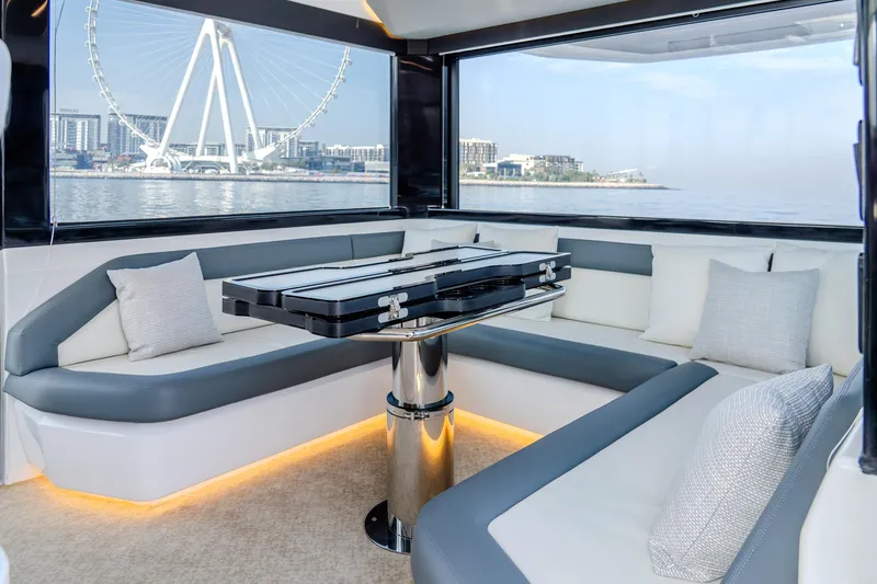 Slide: The Image of Luxurious interior of 2025 Oryx 47 LX yacht with waterfront view and modern seating. - 12