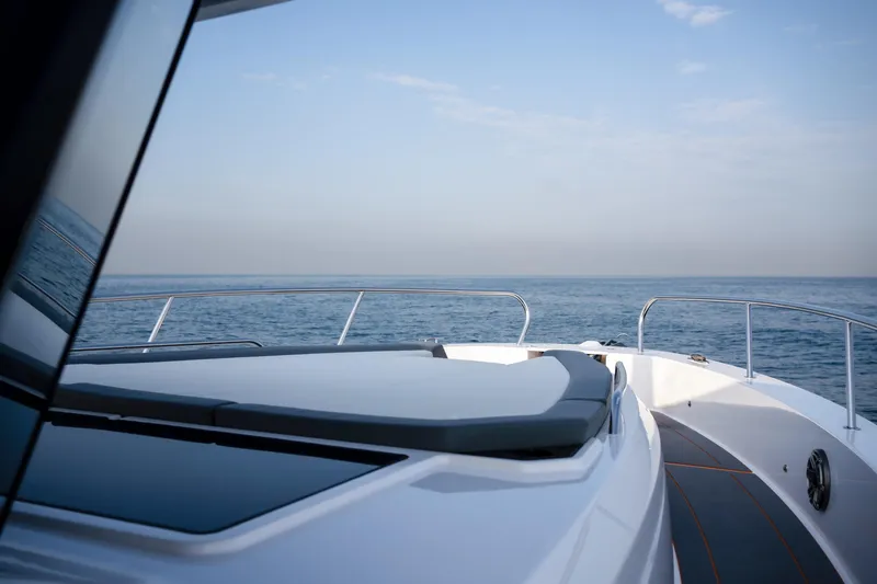 Slide: The Image of Luxury Oryx 47 LX yacht deck overlooking serene ocean, 2025 model. - 3