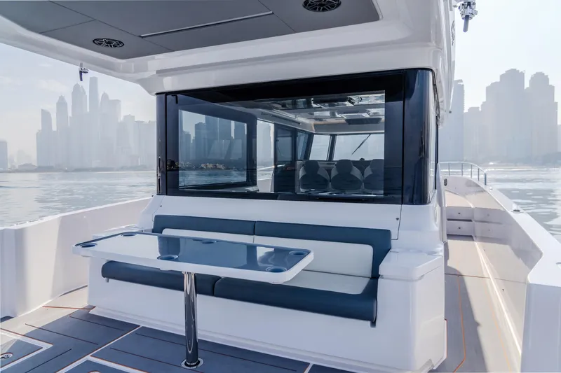 Slide: The Image of Luxury Oryx 47 LX yacht interior with city skyline, 2025 model. - 4