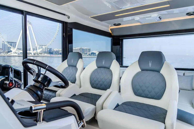 Slide: The Image of Luxurious interior of 2025 Oryx 47 LX yacht with modern seating and panoramic views. - 8