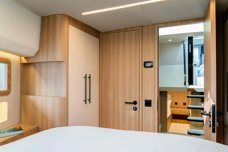 Slide: The Image of Luxurious interior of 2025 Oryx 47 LX yacht with modern wood finishes. - 9