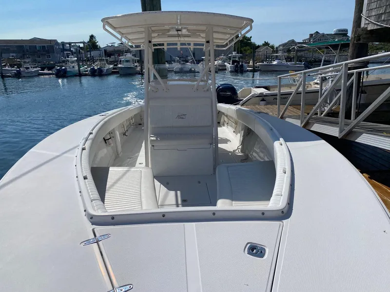 Slide: The Image of 2004 Jupiter 31 FS boat helm with steering wheel and controls. - 13