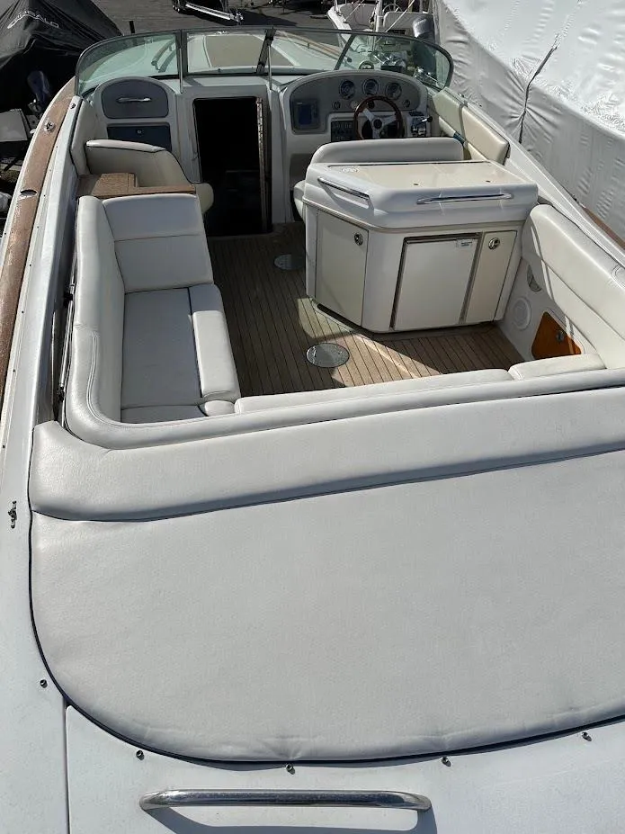 Slide: The Image of 2003 Chris-Craft 28' Corsair boat interior with seating and helm. - 10