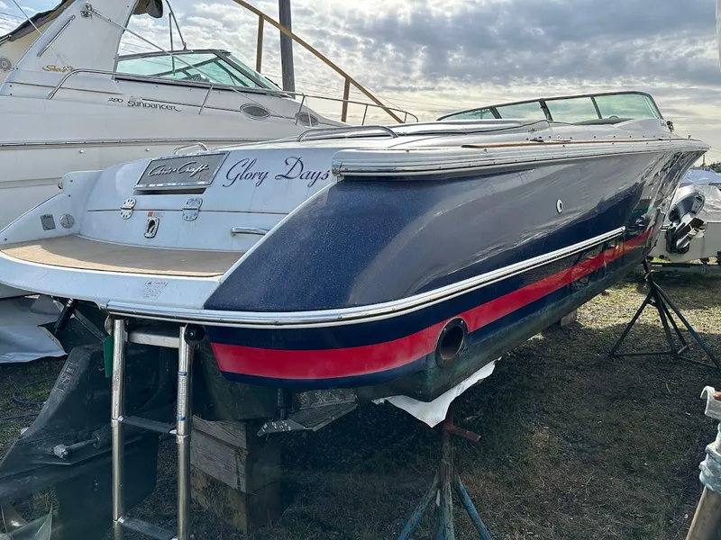 Slide: The Image of 2003 Chris-Craft 28' Corsair boat named "Glory Days" on dry dock, side view. - 2