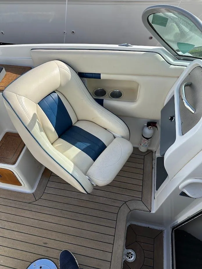 Slide: The Image of 2003 Chris-Craft 28' Corsair boat interior with white and blue seating. - 24