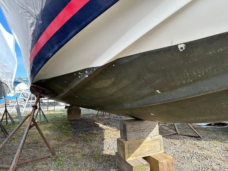 Slide: The Image of 2003 Chris-Craft 28' Corsair boat hull on stands, showing underside details. - 30