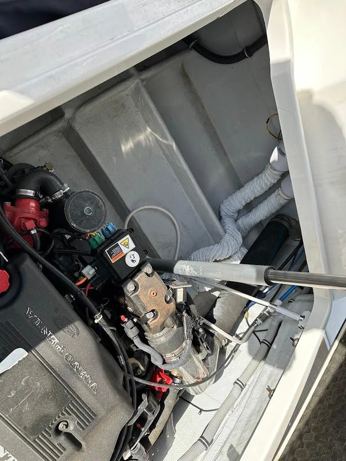 Slide: The Image of Engine compartment of a 2003 Chris-Craft 28' Corsair boat, showcasing mechanical components. - 7