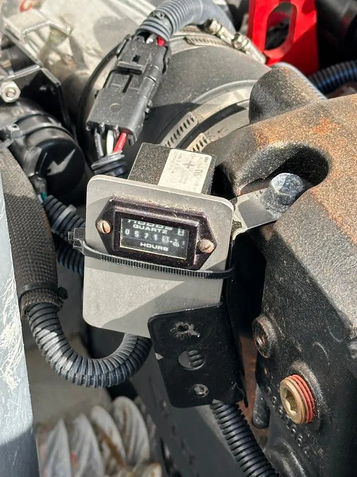 Slide: The Image of Hour meter on 2003 Chris-Craft 28' Corsair engine, displaying usage hours. - 9
