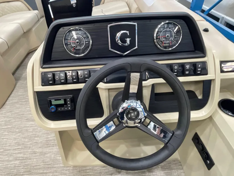 Slide: The Image of Steering console of 2025 Godfrey SW2286SFLC Tritoon with gauges and controls. - 10