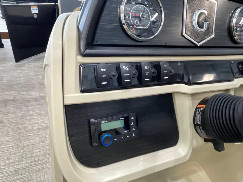 Slide: The Image of Dashboard of 2025 Godfrey SW2286SFLC Tritoon with controls and gauges. - 11