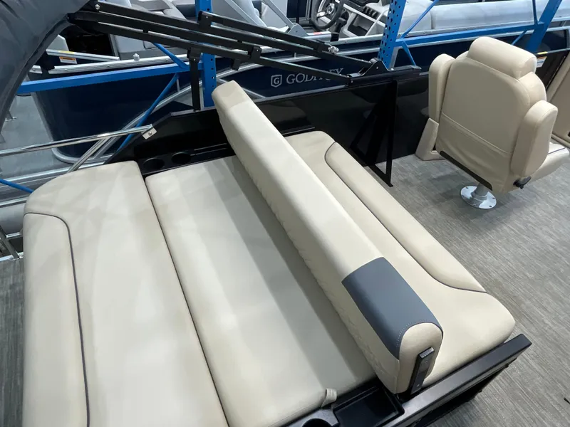 Slide: The Image of 2025 Godfrey SW2286SFLC Tritoon with beige seating and adjustable backrest. - 16