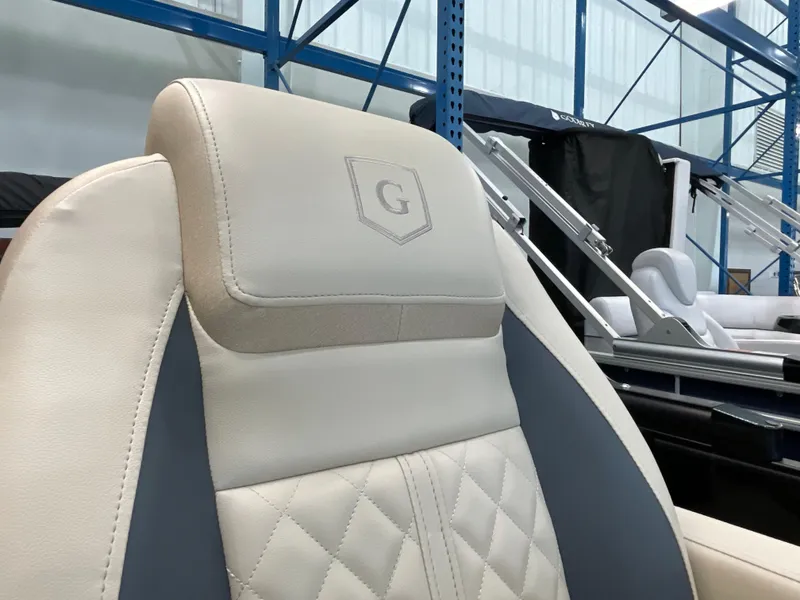 Slide: The Image of Luxurious seating on 2025 Godfrey SW2286SFLC Tritoon, featuring elegant stitching and logo detail. - 20