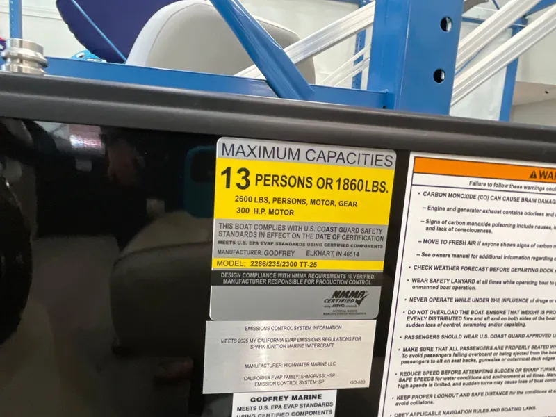 Slide: The Image of Capacity label on 2025 Godfrey SW2286SFLC Tritoon, showing limits for persons and weight. - 24