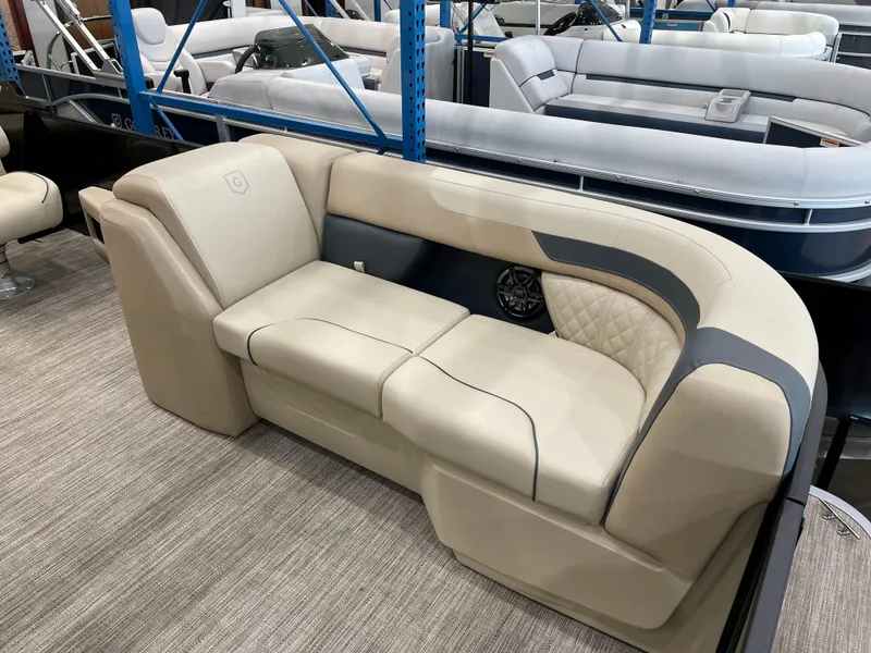 Slide: The Image of Luxurious seating on 2025 Godfrey SW2286SFLC Tritoon, featuring elegant beige upholstery. - 4