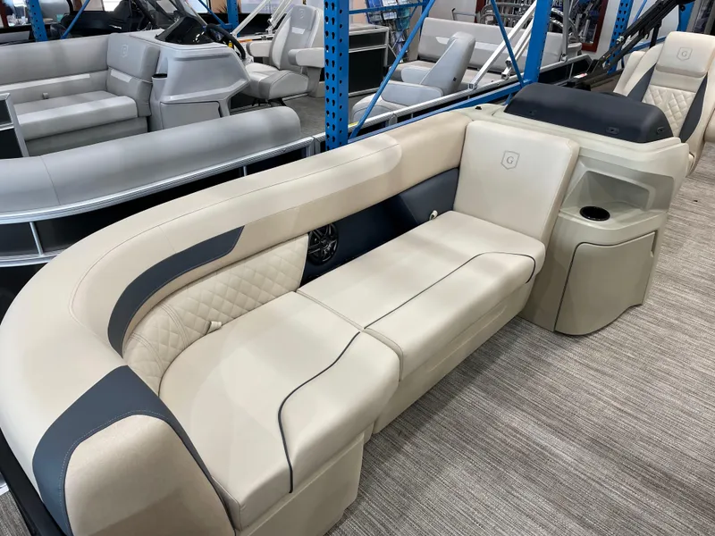 Slide: The Image of Luxurious seating on 2025 Godfrey SW2286SFLC Tritoon boat, featuring elegant beige upholstery. - 5