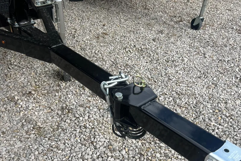 Slide: The Image of Trailer hitch of 2025 SeaArk 1960 Slayer Pro on gravel surface. - 7