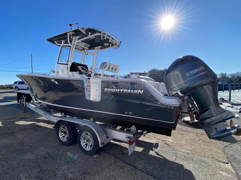 Slide: The Image of 2020 Sportsman Heritage 251 Center Console boat on trailer, sunny day, Yamaha engine. - 2