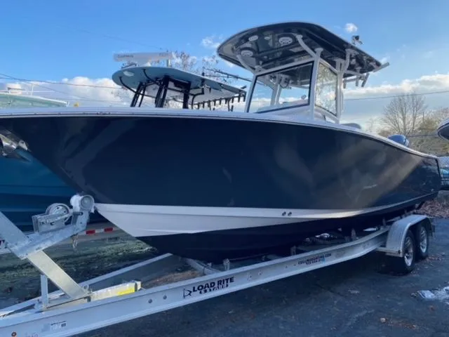 Slide: The Image of 2020 Sportsman Heritage 251 Center Console boat on trailer, side view. - 5