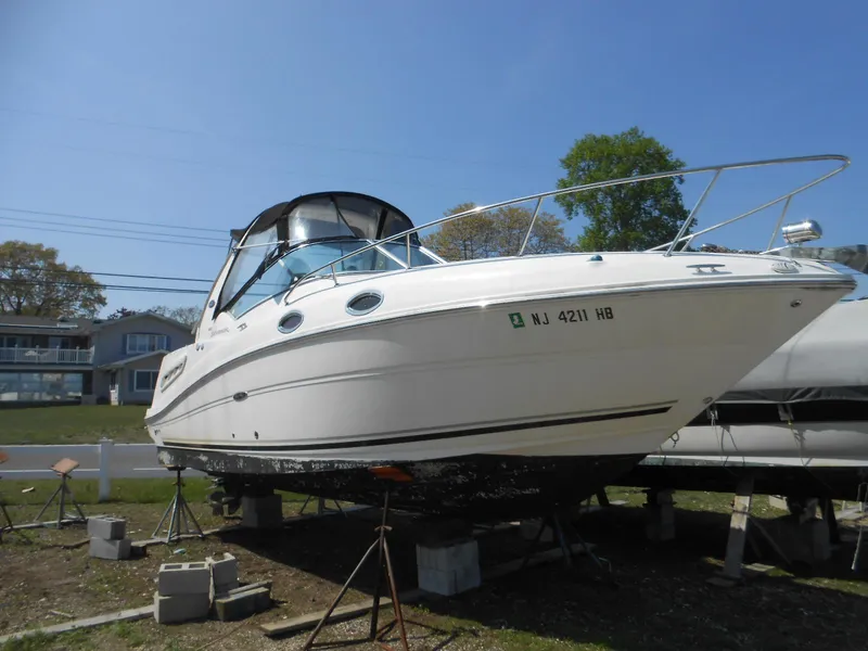 The Image of 2008 Sea Ray 260 Sundancer boat on stands, ready for maintenance. - 0