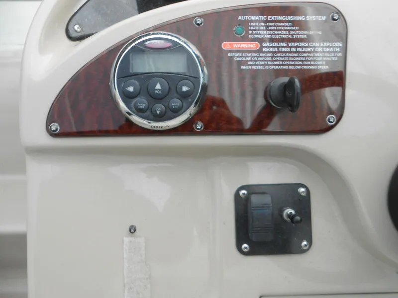 Slide: The Image of Control panel of a 2008 Sea Ray 260 Sundancer boat with warning labels and controls. - 15