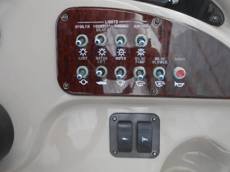 Slide: The Image of Control panel of a 2008 Sea Ray 260 Sundancer boat with various switches and indicators. - 16