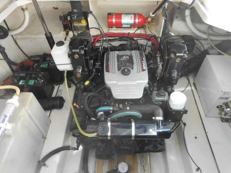 Slide: The Image of Engine compartment of a 2008 Sea Ray 260 Sundancer boat, featuring a well-maintained motor. - 17
