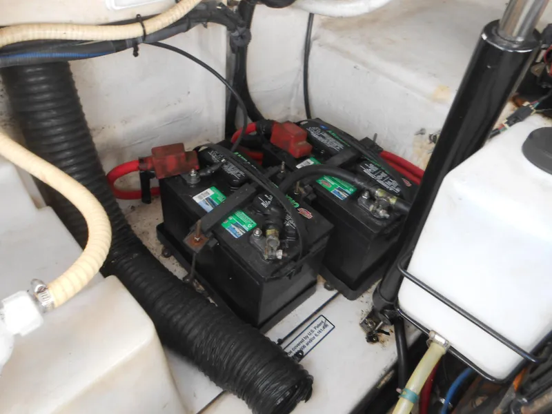 Slide: The Image of Batteries in the engine compartment of a 2008 Sea Ray 260 Sundancer boat. - 21