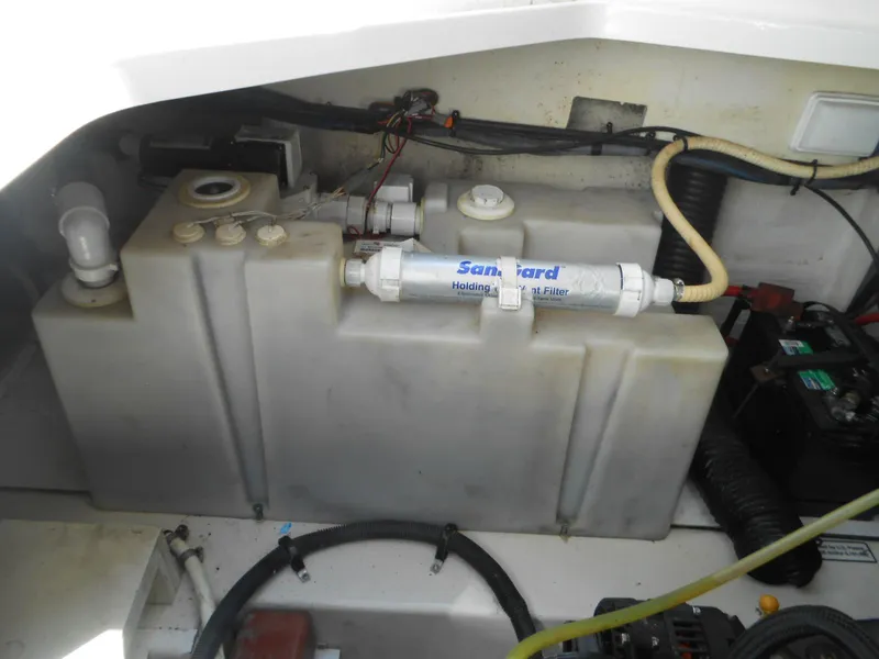 Slide: The Image of Engine compartment of a 2008 Sea Ray 260 Sundancer with holding tank and filter system. - 22